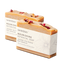 2 pale orange textured soap bars with pink flower petals on top. A white label is wrapped around each bar, reading "nourishing botanical soap"